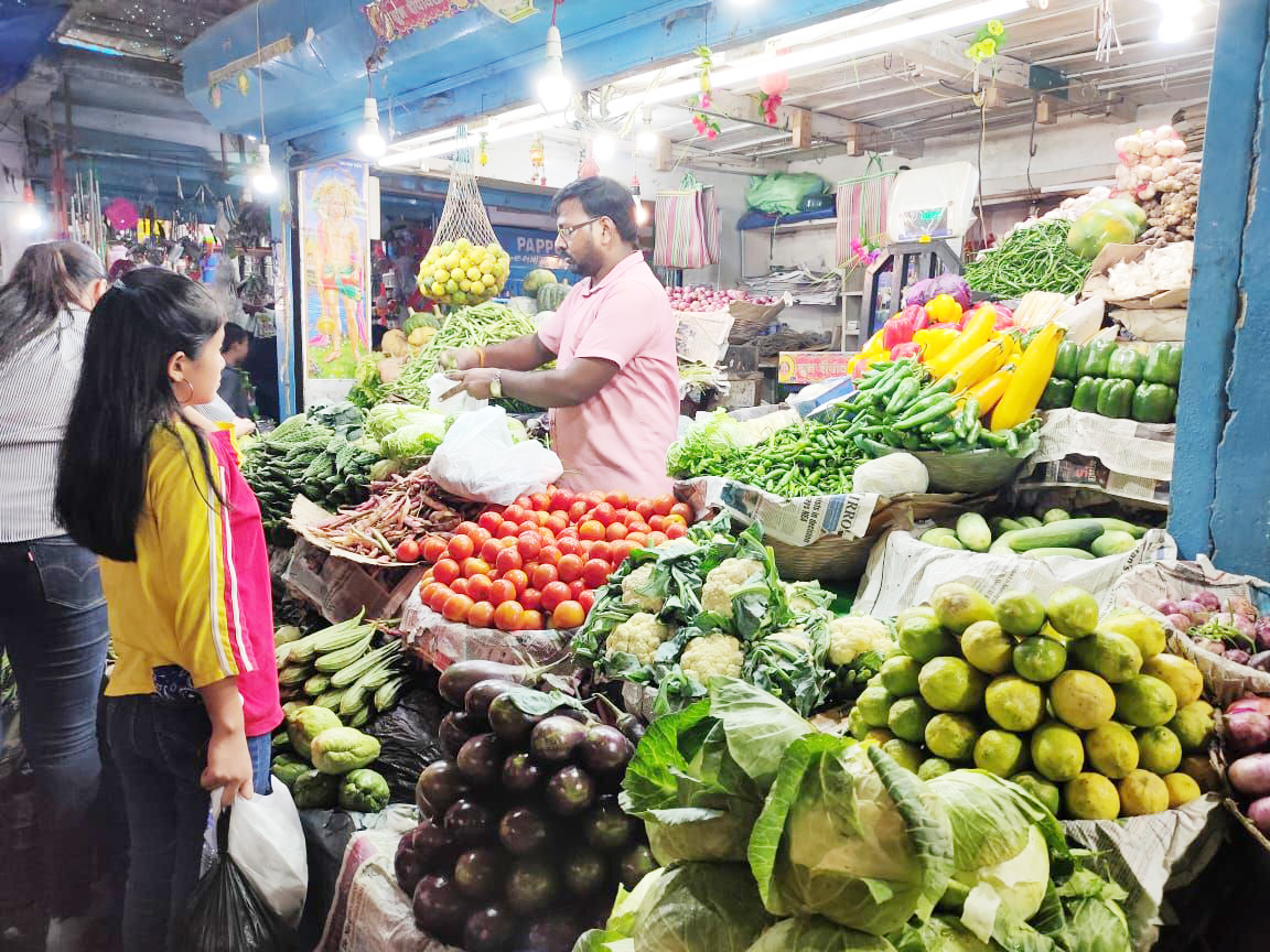 A vegetable vendor attending to a customer at New Market area, Dimapur. Retail prices of perishables fluctuates. (Photo for Representational purposes only/Morung File Photo) 